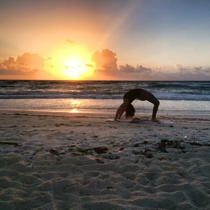 Erin doing yoga in Tulum